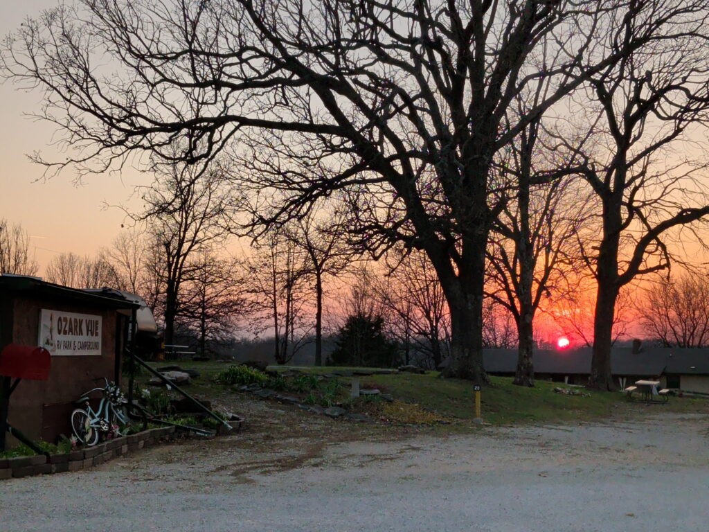 Ozark sunset through the trees at Ozark View RV Park