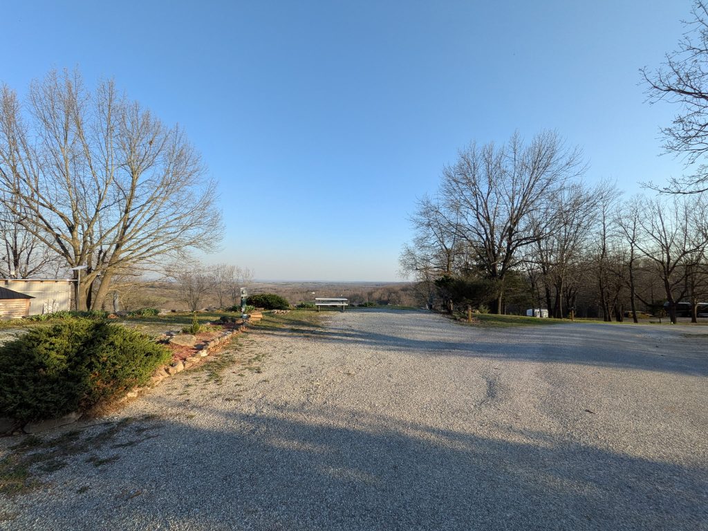 Gravel pull-thru RV sites with scenic valley overlook at Ozark View RV Park near Branson MO