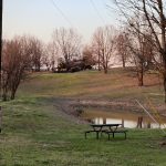 Pond and picnic area at Ozark View RV Park near Branson MO at dusk